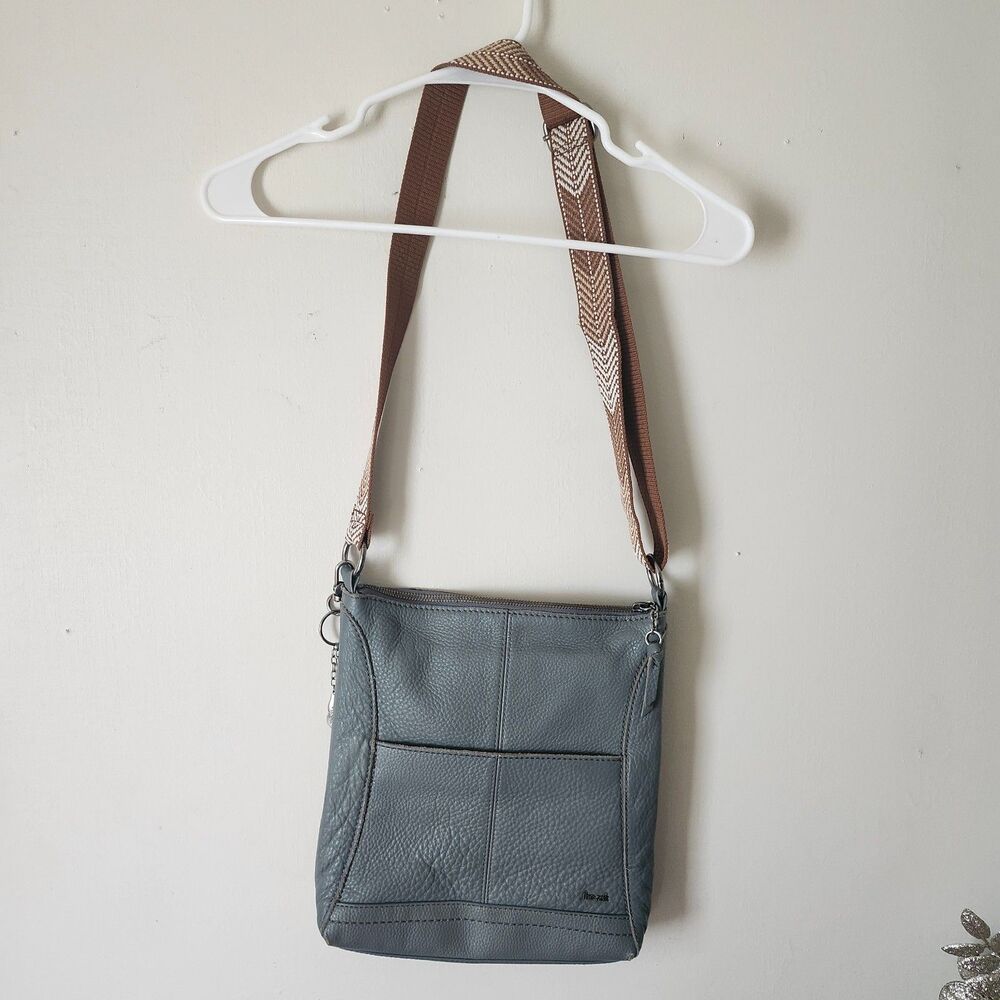 The Sak Gray Leather Crossbody Bag Adjustable Strap Front Pocket Charm Hobo
